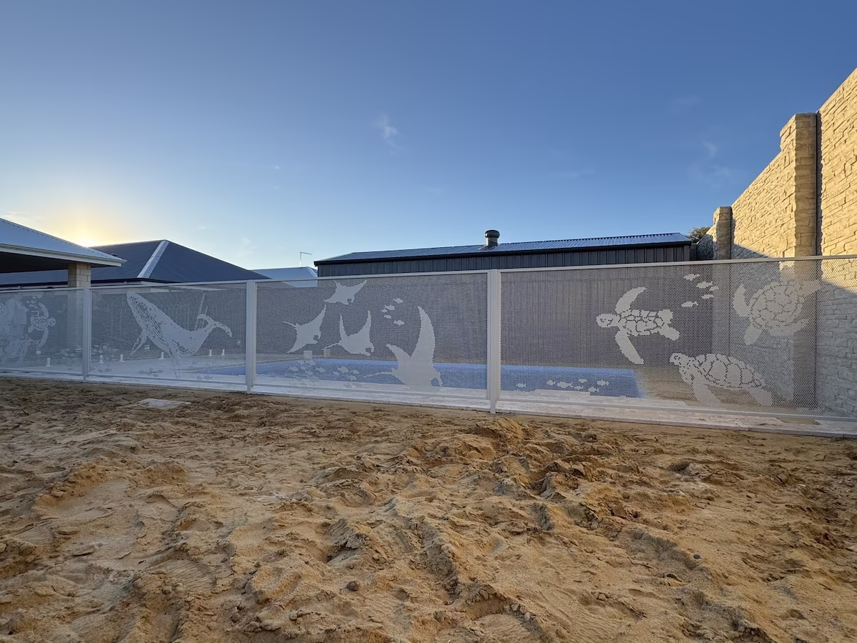 Custom Pool Perf® perforated pool fencing in Textured Surfmist